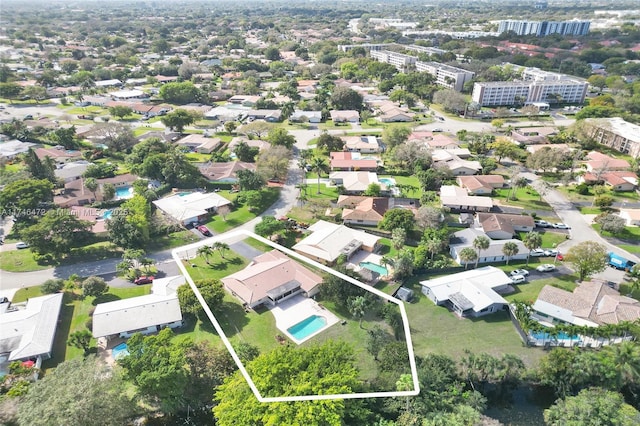 birds eye view of property with a residential view