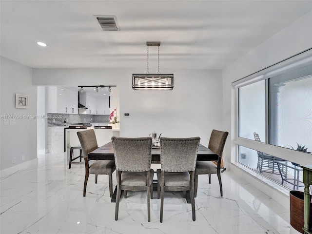 3204 Robbins Rd, Pompano Beach, FL 33062 - dining area featuring light marble finish flooring and recessed lighting