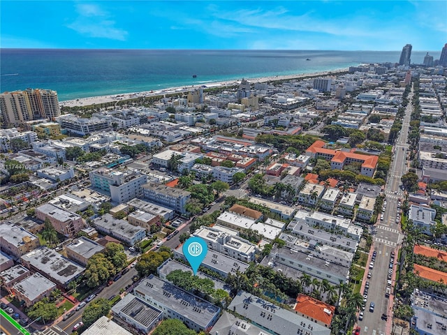 bird's eye view with a water view, a beach view, and a city view