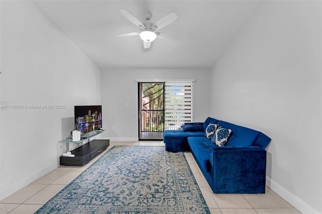 sitting room featuring light tile patterned floors, ceiling fan, and baseboards