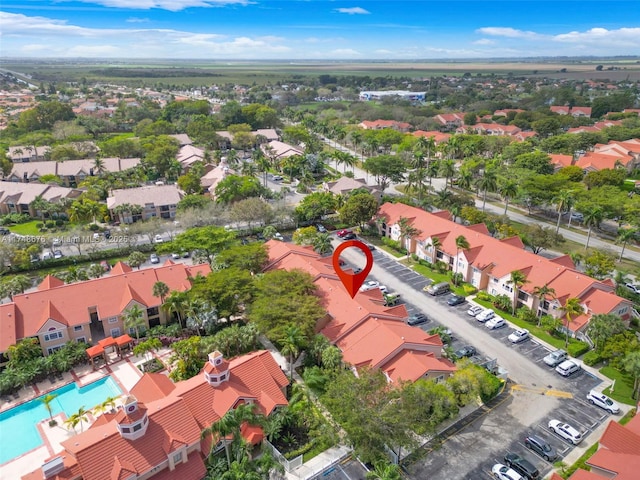 birds eye view of property with a residential view