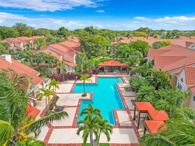 community pool featuring a patio area and a residential view