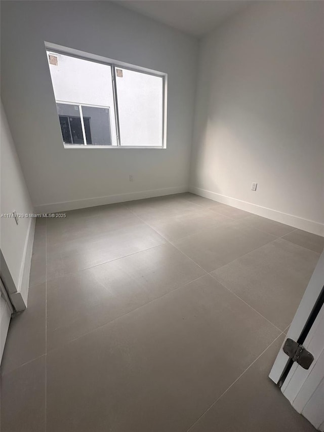 empty room with baseboards