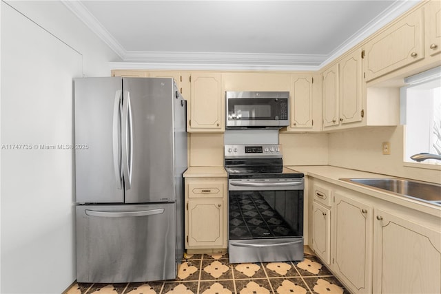 kitchen with stainless steel appliances, light countertops, a sink, and ornamental molding