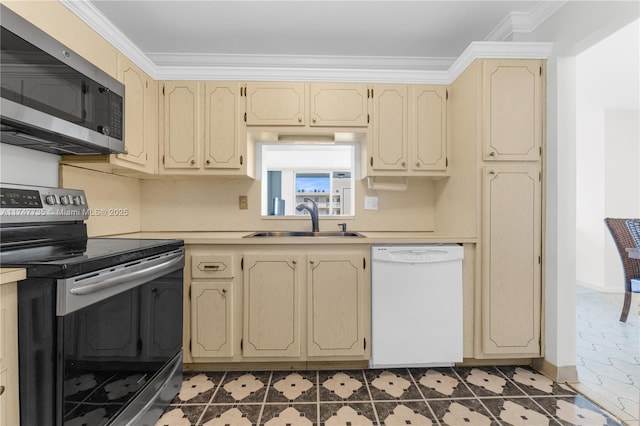 kitchen featuring a sink, stainless steel appliances, light countertops, and crown molding