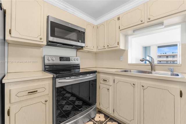 kitchen with stainless steel appliances, light countertops, a sink, and crown molding