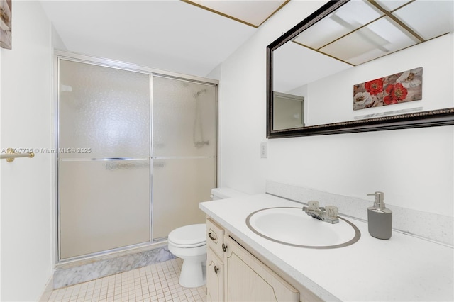 bathroom with a stall shower, tile patterned flooring, vanity, and toilet