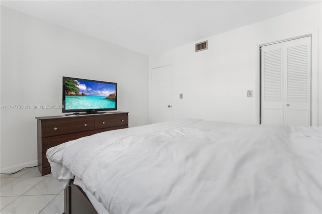 bedroom featuring visible vents