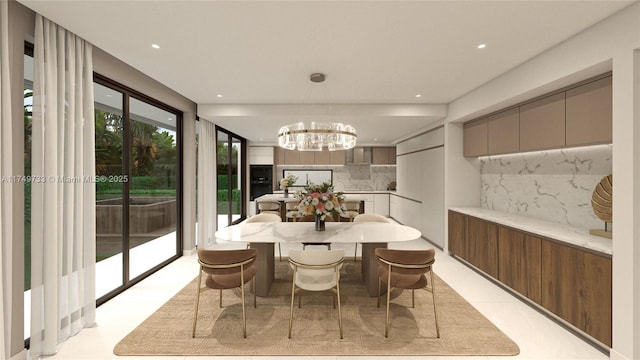 dining area featuring recessed lighting and an inviting chandelier