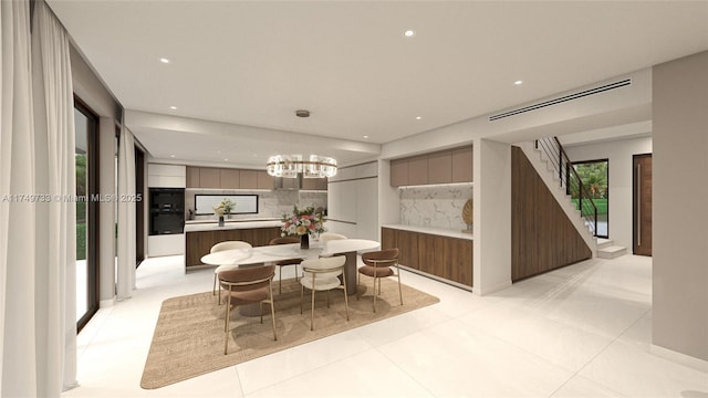 dining area with a chandelier, recessed lighting, visible vents, and stairs