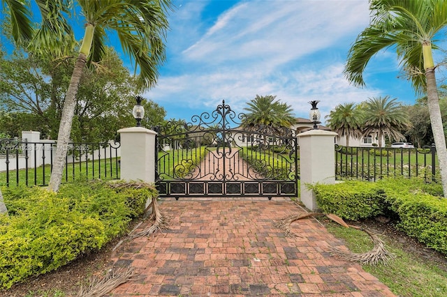 view of gate featuring fence