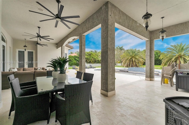 view of patio featuring ceiling fan, outdoor dining area, and an outdoor hangout area