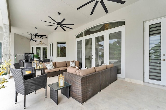 view of patio featuring french doors, ceiling fan, and an outdoor living space