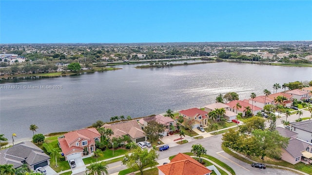 aerial view with a water view and a residential view