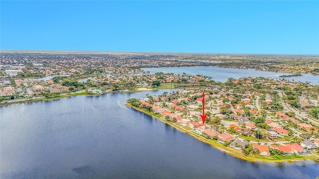 drone / aerial view with a residential view and a water view