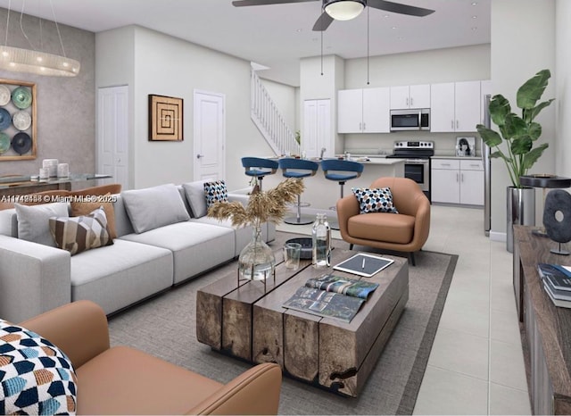 living room featuring stairs, ceiling fan, a towering ceiling, and light tile patterned floors