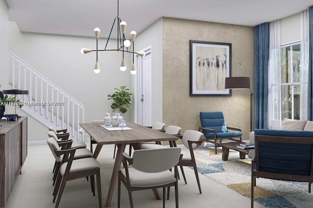 dining area featuring stairs and a notable chandelier