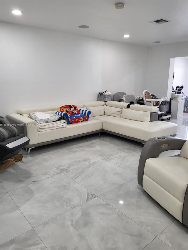 living area with recessed lighting and visible vents