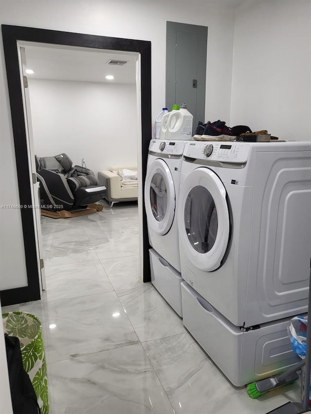 washroom with laundry area, electric panel, visible vents, marble finish floor, and separate washer and dryer