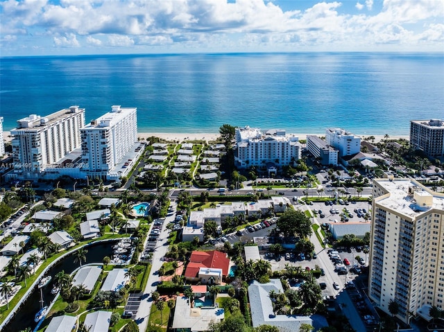 drone / aerial view featuring a view of city and a water view