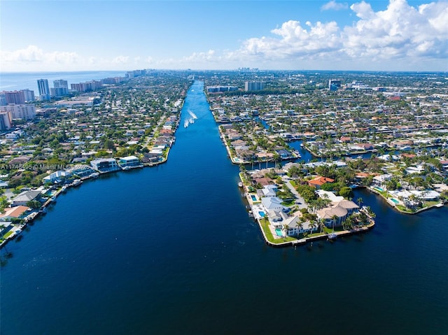 birds eye view of property featuring a view of city and a water view