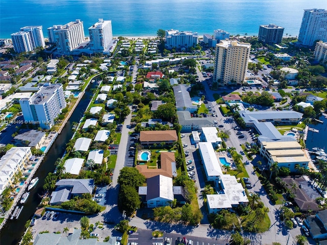 bird's eye view featuring a view of city and a water view