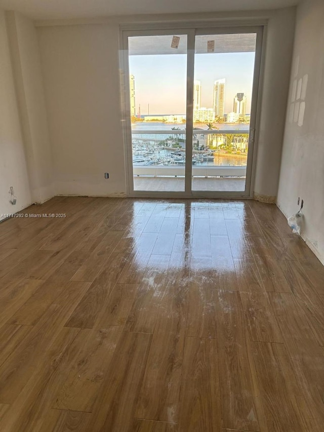 7000 Island Blvd Unit 905, Aventura, FL 33160 - empty room featuring a city view and wood finished floors