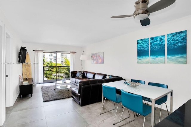 living room featuring light tile patterned floors and a ceiling fan