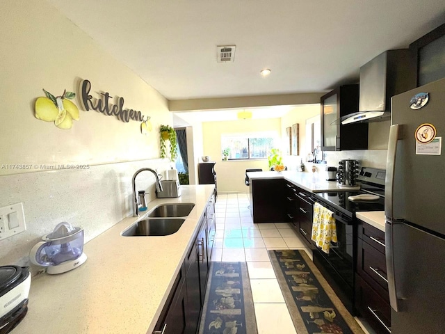 8415 SW 107th Ave Unit 363W, Miami, FL 33173 - kitchen with freestanding refrigerator, black / electric stove, light countertops, light tile patterned floors, and recessed lighting