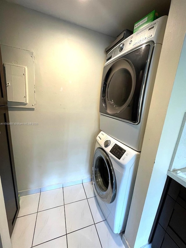 8415 SW 107th Ave Unit 363W, Miami, FL 33173 - washroom featuring stacked washer / dryer and baseboards