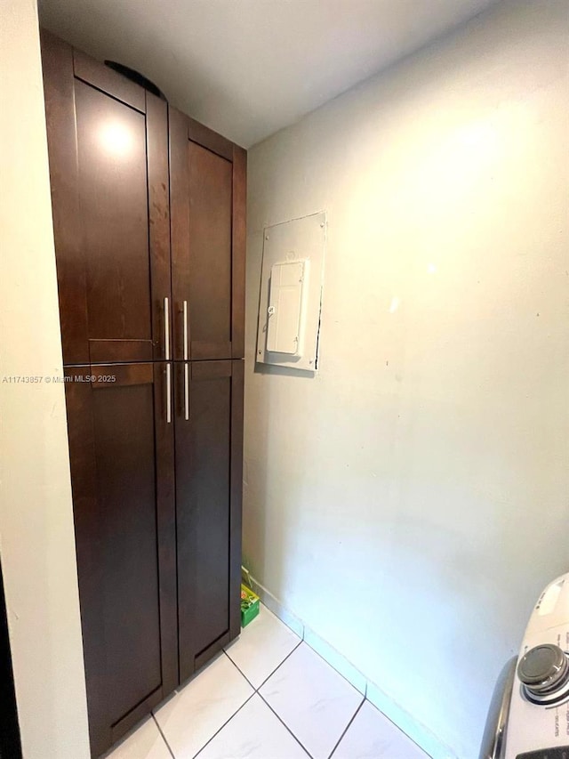 8415 SW 107th Ave Unit 363W, Miami, FL 33173 - hall with electric panel and light tile patterned floors