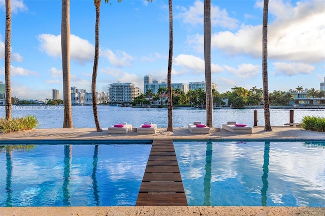 pool with a view of city and a water view