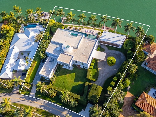 birds eye view of property with a water view