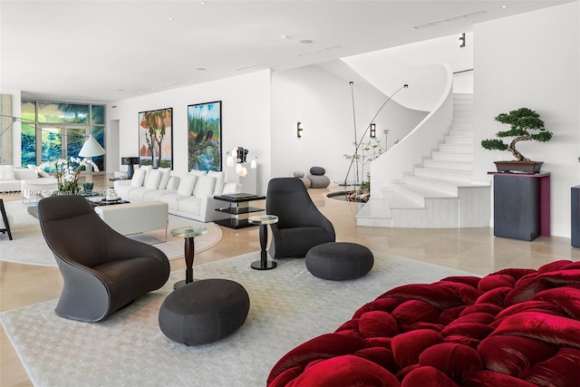 living room with stairs and visible vents