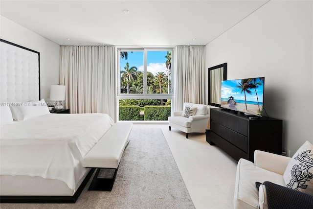 bedroom featuring a wall of windows