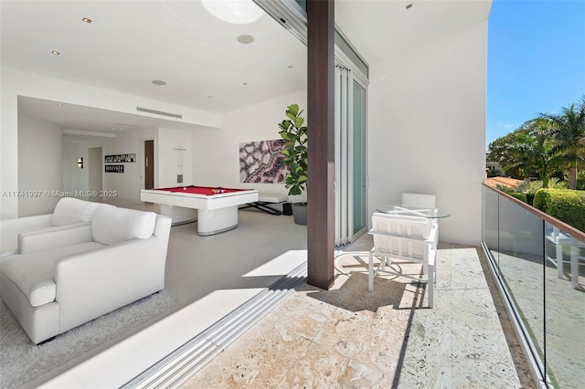 game room with concrete flooring and billiards