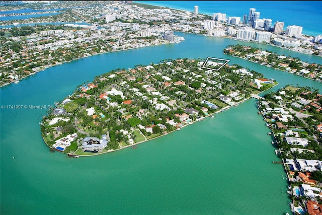 birds eye view of property with a view of city and a water view