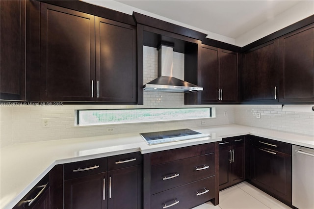 kitchen with tasteful backsplash, light countertops, stainless steel dishwasher, wall chimney range hood, and black electric cooktop