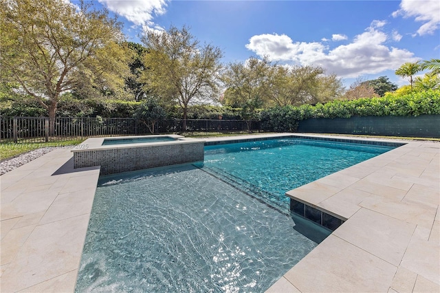 view of swimming pool featuring a patio area, a fenced backyard, and a pool with connected hot tub