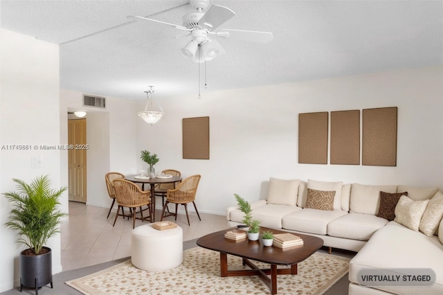 2401 Antigua Cir Unit E3, Coconut Creek, FL 33066 - living room with a ceiling fan and a textured ceiling