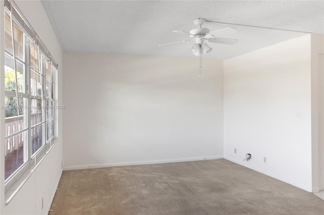 2401 Antigua Cir Unit E3, Coconut Creek, FL 33066 - empty room featuring light colored carpet, a ceiling fan, and a textured ceiling