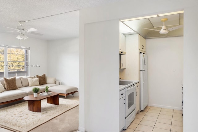 2401 Antigua Cir Unit E3, Coconut Creek, FL 33066 - kitchen featuring ceiling fan, white appliances, light countertops, and white cabinets