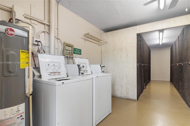 2401 Antigua Cir Unit E3, Coconut Creek, FL 33066 - laundry area with electric water heater, separate washer and dryer, a ceiling fan, a textured ceiling, and wood walls