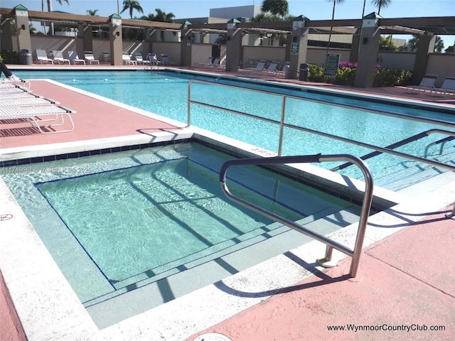 2401 Antigua Cir Unit E3, Coconut Creek, FL 33066 - community pool featuring a residential view and a pergola