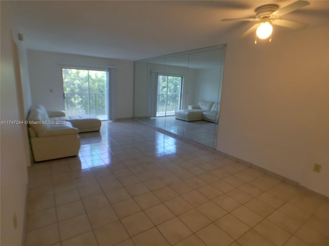 1821 Jefferson Ave Unit 205, Miami Beach, FL 33139 - unfurnished living room with light tile patterned flooring and ceiling fan