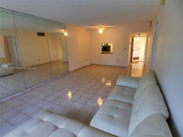 1821 Jefferson Ave Unit 205, Miami Beach, FL 33139 - living area featuring tile patterned flooring and a ceiling fan
