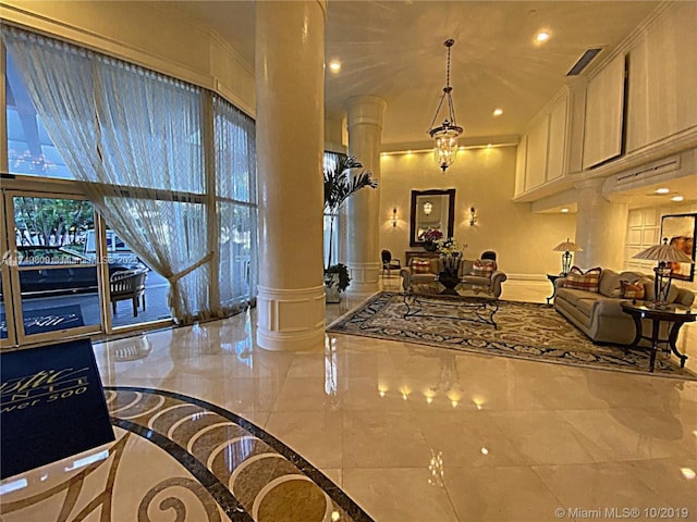 3530 Mystic Pointe Dr Unit 2303, Aventura, FL 33180 - lobby featuring a decorative wall, recessed lighting, ornamental molding, and wainscoting