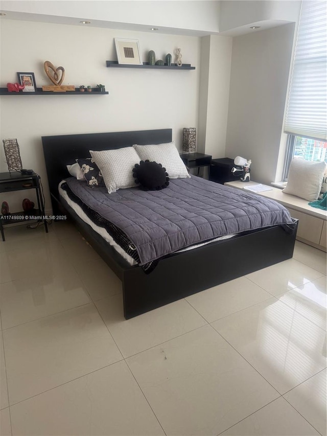 bedroom featuring light tile patterned floors