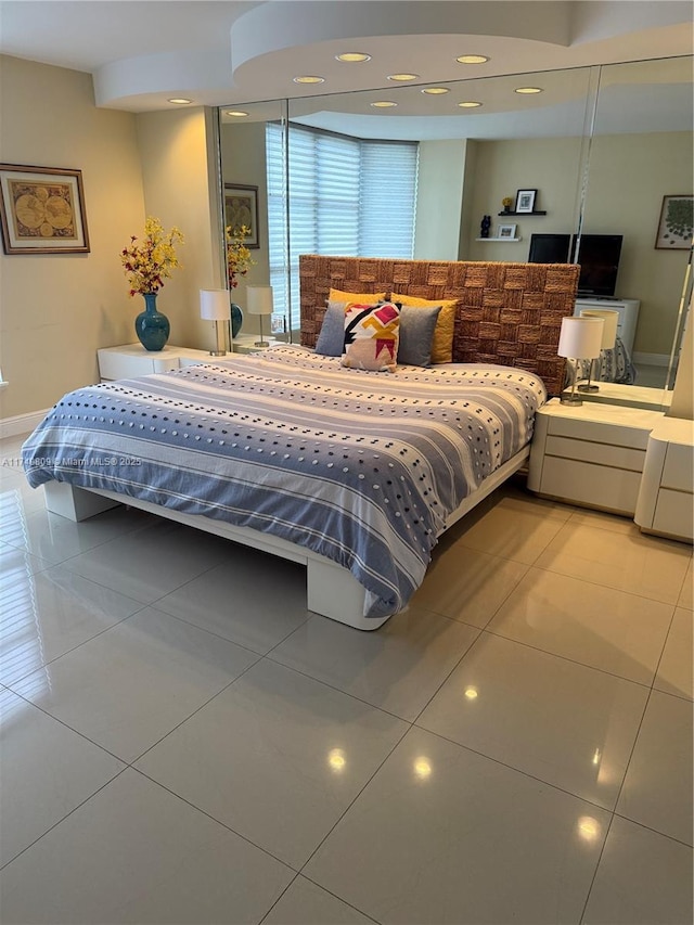 3530 Mystic Pointe Dr Unit 2303, Aventura, FL 33180 - bedroom with light tile patterned floors, recessed lighting, and baseboards