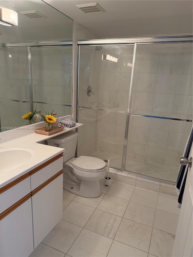 3530 Mystic Pointe Dr Unit 2303, Aventura, FL 33180 - bathroom featuring tile patterned floors, a stall shower, vanity, and toilet
